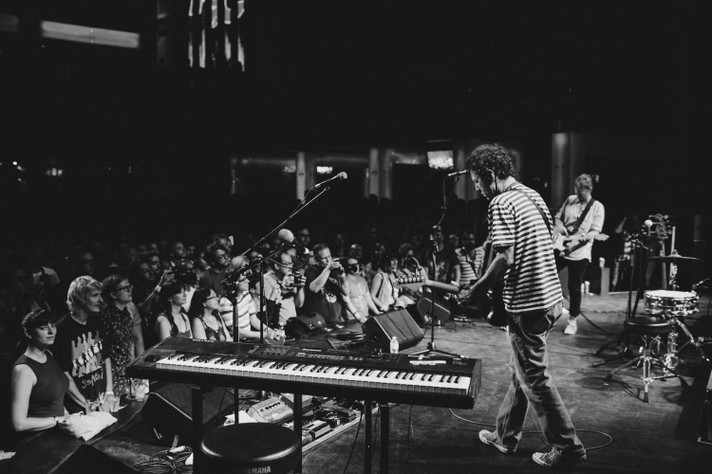 A black and white photo shows the group Yo La Tengo performing at Flames Central during Sled Island 2015.
