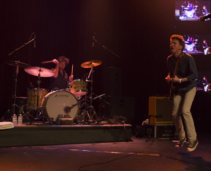 The drummer and the guitar player for the group Superchunk are seen performing on stage at Flames Central during Sled Island 2013.