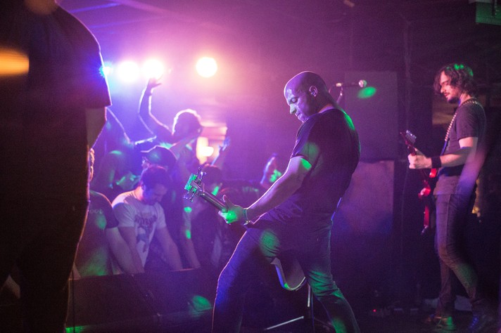 The metal group Torche is shown performing for an energetic crowd at Dickens during Sled Island 2013.