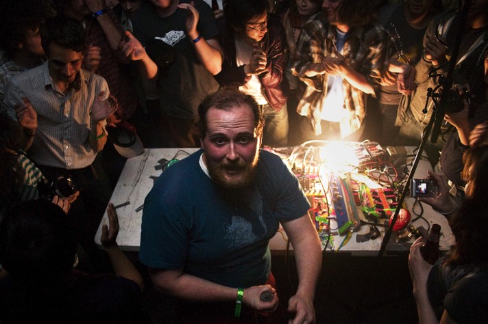 Artist Dan Deacon looks back at the photographer while performing in front of a crowd at The Warehouse during Sled Island 2008.