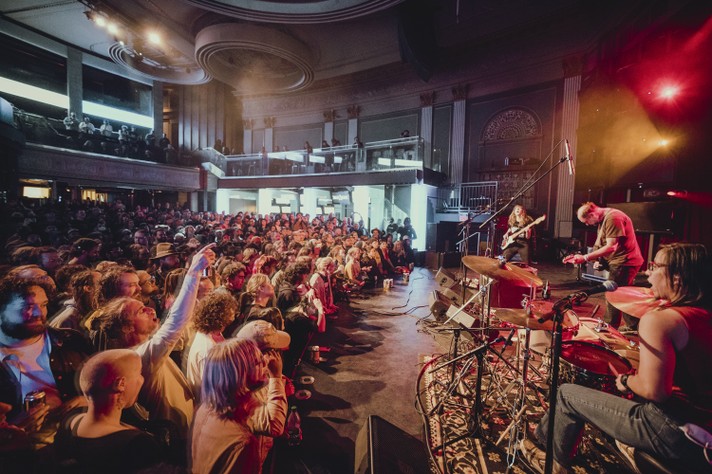 The trio Built to Spill is seen performing to a packed house at The Palace Theatre during Sled Island 2022.